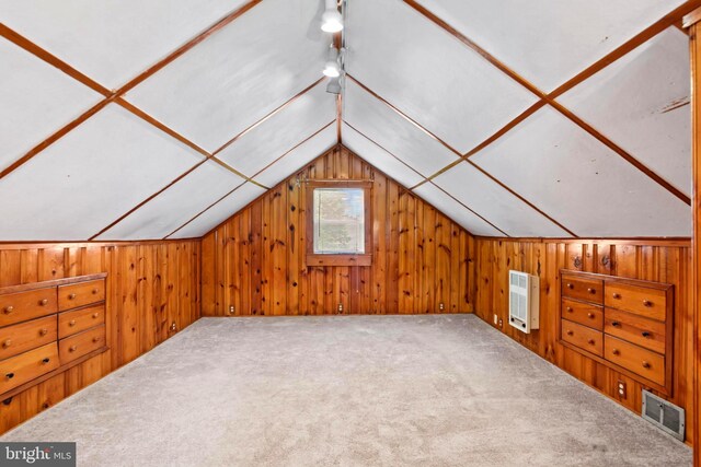 201 Village Rd, Harrisburg, PA 17112 - additional living space with heating unit, vaulted ceiling, wooden walls, and carpet