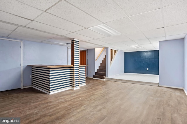 201 Village Rd, Harrisburg, PA 17112 - finished below grade area with wood finished floors, stairway, a paneled ceiling, and baseboards