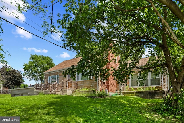 201 Village Rd, Harrisburg, PA 17112 - view of front of home featuring a front yard, stone siding, and roof with shingles