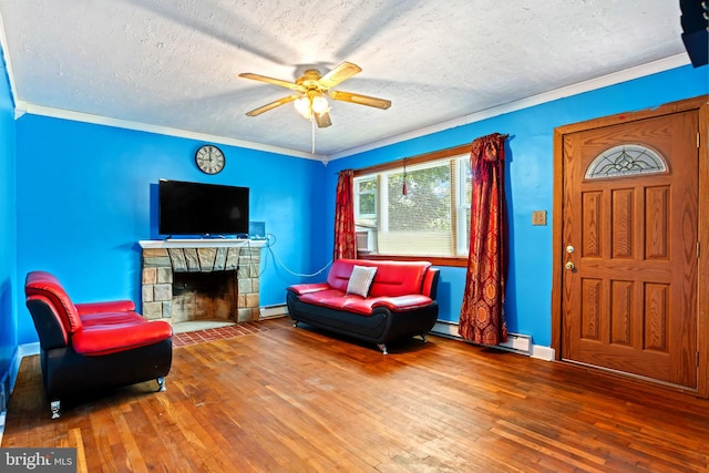 201 Village Rd, Harrisburg, PA 17112 - living room featuring ceiling fan, wood-type flooring, a textured ceiling, baseboard heating, and baseboards