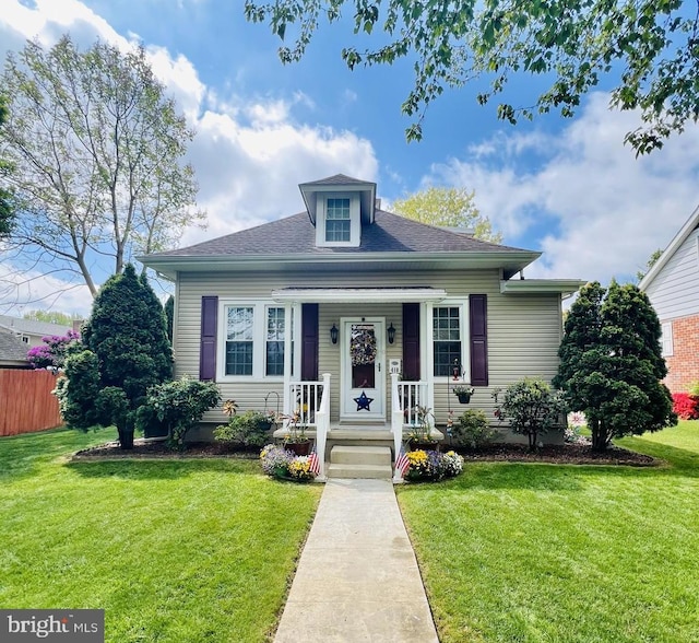 410 Windsor St, Wyomissing, PA 19610 - bungalow with a front lawn, a porch, and a shingled roof