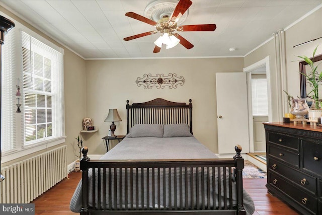 410 Windsor St, Wyomissing, PA 19610 - bedroom featuring radiator heating unit, dark wood-type flooring, crown molding, and a ceiling fan