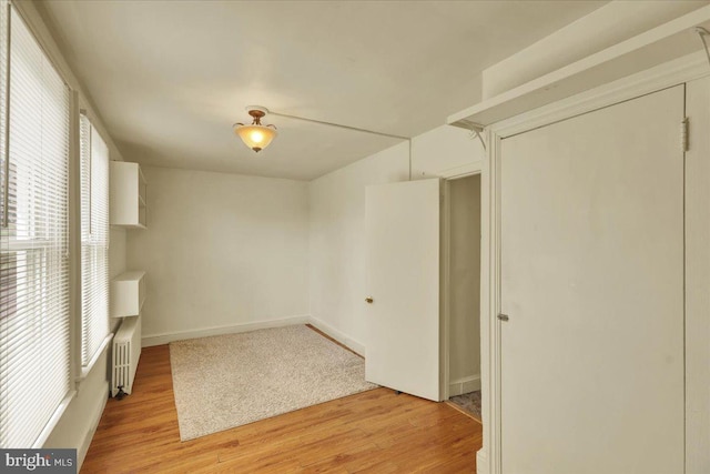 410 Windsor St, Wyomissing, PA 19610 - spare room featuring light wood finished floors, radiator heating unit, and baseboards