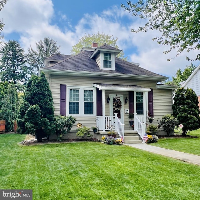 410 Windsor St, Wyomissing, PA 19610 - bungalow featuring a front lawn and a shingled roof