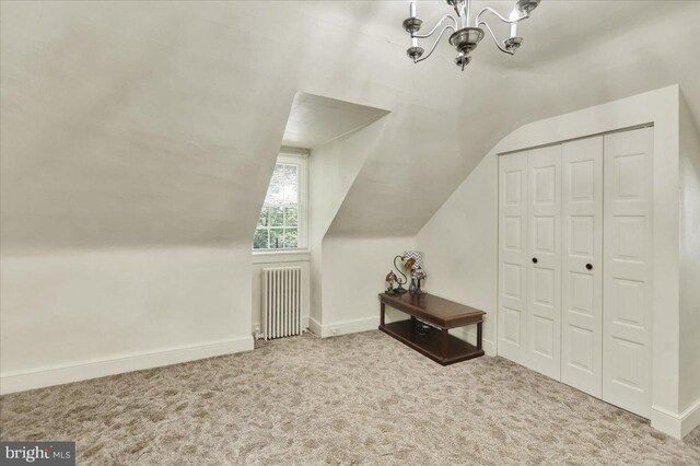 410 Windsor St, Wyomissing, PA 19610 - bonus room featuring radiator heating unit, a chandelier, vaulted ceiling, carpet flooring, and baseboards