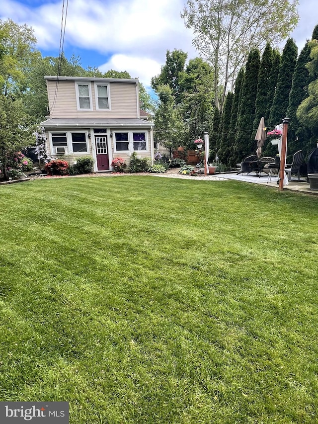 410 Windsor St, Wyomissing, PA 19610 - view of front of house featuring a front yard and a patio