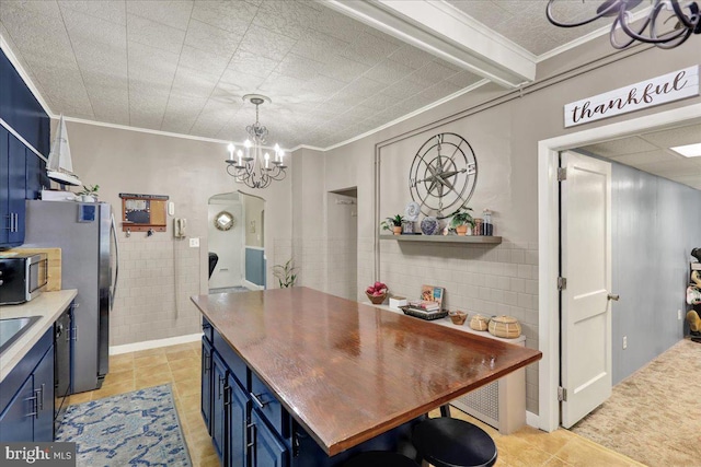 410 Windsor St, Wyomissing, PA 19610 - kitchen featuring blue cabinets, ornamental molding, appliances with stainless steel finishes, a chandelier, and open shelves