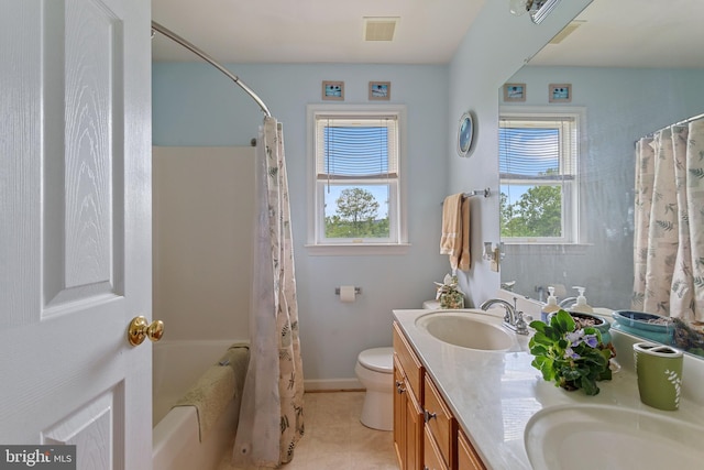 9997 Baltimore National Pike, Myersville, MD 21773 - full bathroom with double vanity, toilet, shower / bath combo, baseboards, and tile patterned flooring