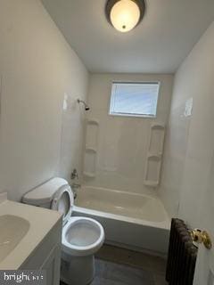 2012 E Glenwood Ave, Philadelphia, PA 19124 - full bathroom featuring radiator heating unit, vanity, toilet, and  shower combination