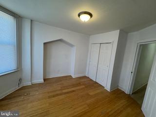 2012 E Glenwood Ave, Philadelphia, PA 19124 - unfurnished bedroom featuring wood finished floors and a closet