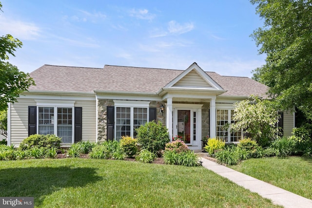 7482 Jeffreys Way, Easton, MD 21601 - view of front of house featuring a front lawn, stone siding, and a shingled roof