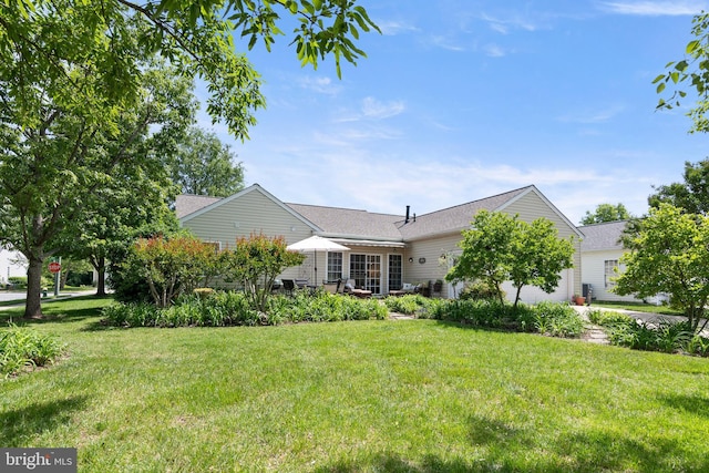7482 Jeffreys Way, Easton, MD 21601 - view of front of property featuring a front lawn, a garage, and a shingled roof