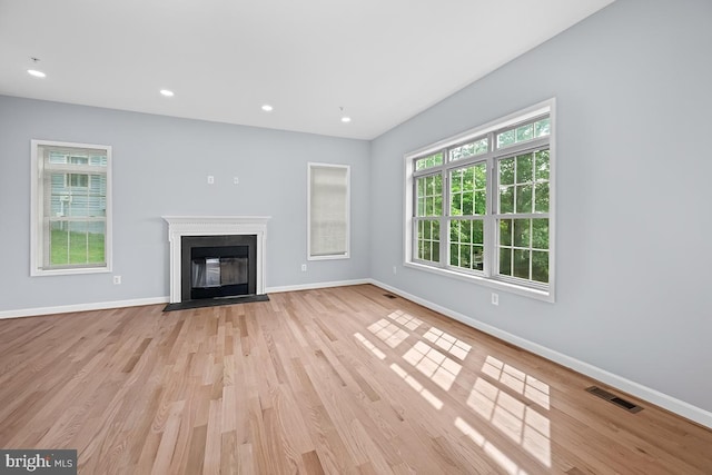 6712 Ridgecrest Rd, New Market, MD 21774 - unfurnished living room featuring baseboards, wood finished floors, a fireplace with flush hearth, and recessed lighting