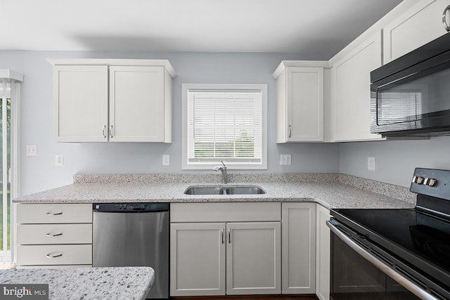 6712 Ridgecrest Rd, New Market, MD 21774 - kitchen with appliances with stainless steel finishes, a sink, healthy amount of natural light, and white cabinetry
