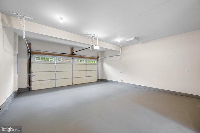 6712 Ridgecrest Rd, New Market, MD 21774 - garage with a garage door opener and baseboards