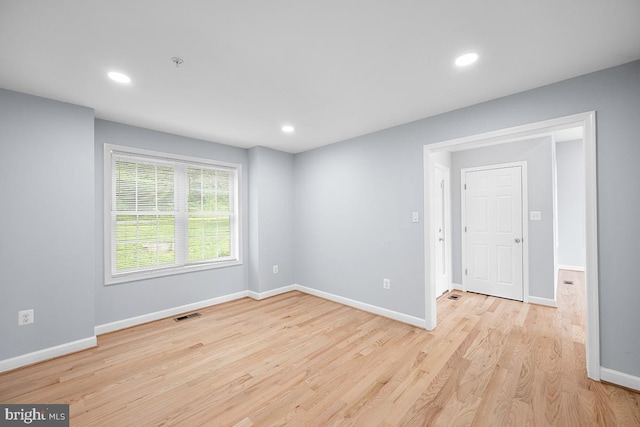 6712 Ridgecrest Rd, New Market, MD 21774 - unfurnished room featuring fire sprinkler in ceiling, baseboards, light wood-style flooring, and recessed lighting