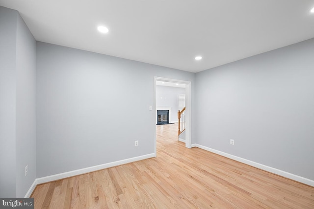 6712 Ridgecrest Rd, New Market, MD 21774 - spare room with baseboards, wood finished floors, and recessed lighting