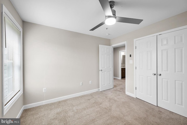 6712 Ridgecrest Rd, New Market, MD 21774 - unfurnished bedroom featuring light colored carpet, multiple windows, baseboards, and a closet