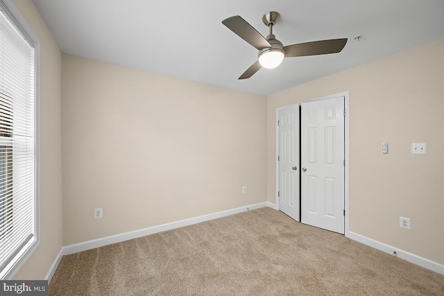 6712 Ridgecrest Rd, New Market, MD 21774 - unfurnished bedroom with light carpet, multiple windows, and baseboards