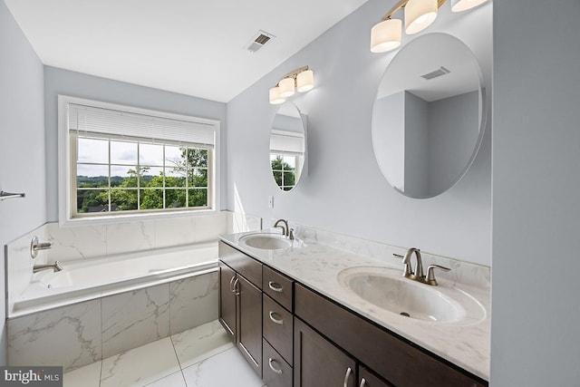 6712 Ridgecrest Rd, New Market, MD 21774 - full bath with marble look tile flooring, double vanity, and a garden tub