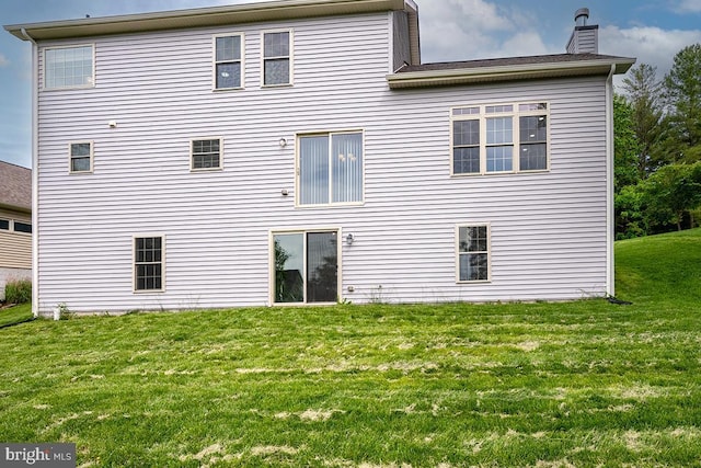6712 Ridgecrest Rd, New Market, MD 21774 - back of property featuring a chimney and a lawn