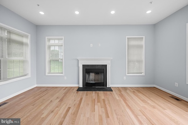 6712 Ridgecrest Rd, New Market, MD 21774 - unfurnished living room featuring wood finished floors, a fireplace with flush hearth, recessed lighting, and baseboards