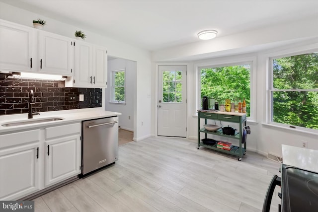 1069 Hearthstone Rd, Lancaster, PA 17603 - kitchen with stainless steel dishwasher, a sink, plenty of natural light, and backsplash