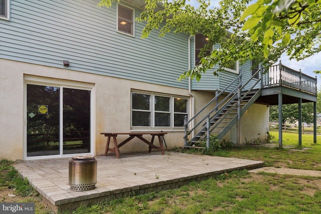 1069 Hearthstone Rd, Lancaster, PA 17603 - rear view of property featuring stairs, stucco siding, a deck, and a patio area
