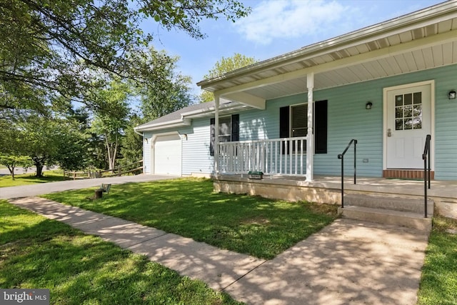 1069 Hearthstone Rd, Lancaster, PA 17603 - view of front of property featuring covered porch, an attached garage, a front lawn, and driveway