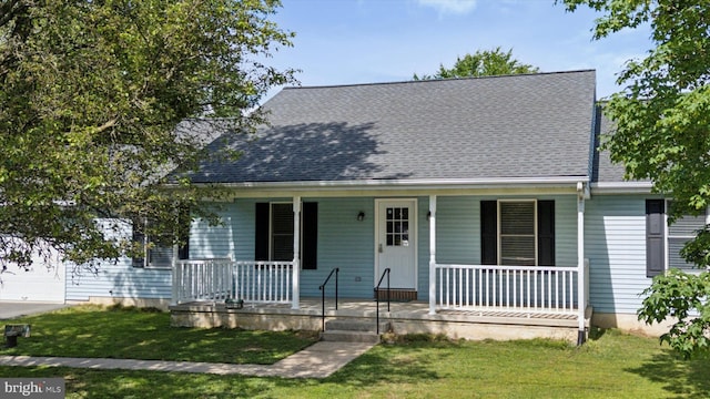 1069 Hearthstone Rd, Lancaster, PA 17603 - view of front of home with covered porch, a front yard, and a shingled roof