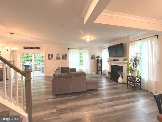16801 Chalet Ct, Chesterfield, VA 23832 - living area featuring wood finished floors, a fireplace, ornamental molding, stairway, and a chandelier