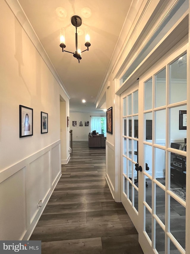 16801 Chalet Ct, Chesterfield, VA 23832 - corridor with ornamental molding, french doors, dark wood-type flooring, a chandelier, and wainscoting