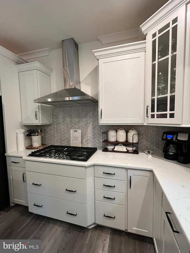 16801 Chalet Ct, Chesterfield, VA 23832 - kitchen with wall chimney exhaust hood, stainless steel gas stovetop, white cabinetry, decorative backsplash, and glass insert cabinets