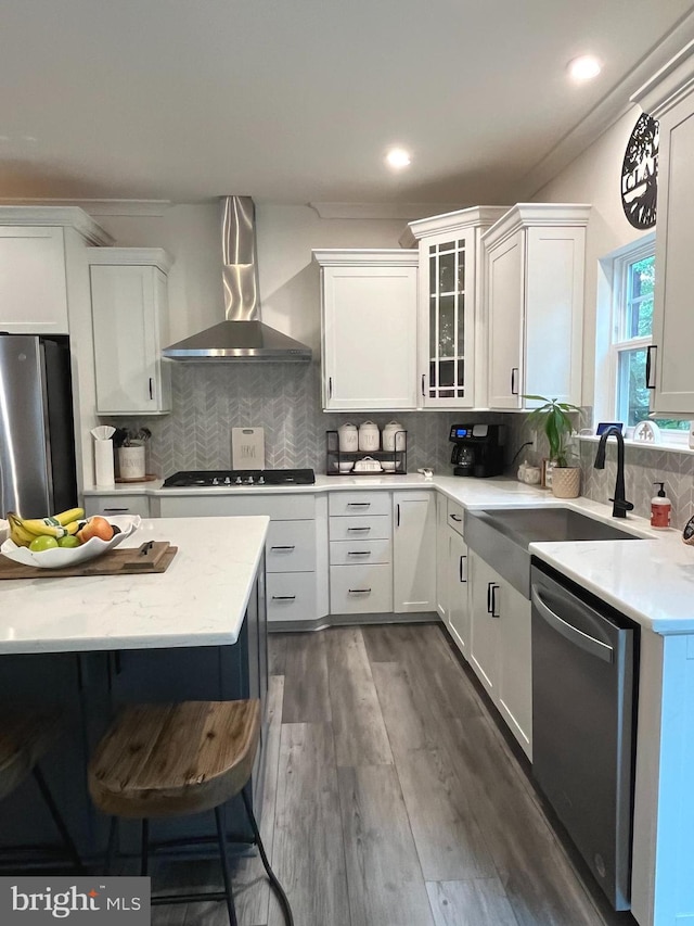 16801 Chalet Ct, Chesterfield, VA 23832 - kitchen with wall chimney range hood, stainless steel appliances, a sink, white cabinetry, and recessed lighting