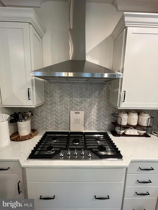 16801 Chalet Ct, Chesterfield, VA 23832 - kitchen with wall chimney range hood, decorative backsplash, stainless steel gas cooktop, white cabinets, and light stone counters