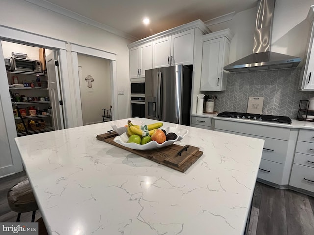 16801 Chalet Ct, Chesterfield, VA 23832 - kitchen featuring stainless steel appliances, wall chimney range hood, crown molding, backsplash, and a kitchen island