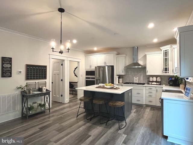 16801 Chalet Ct, Chesterfield, VA 23832 - kitchen featuring wall chimney exhaust hood, stainless steel appliances, a sink, crown molding, and light countertops