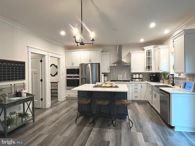 16801 Chalet Ct, Chesterfield, VA 23832 - kitchen with wall chimney range hood, appliances with stainless steel finishes, ornamental molding, a sink, and light countertops