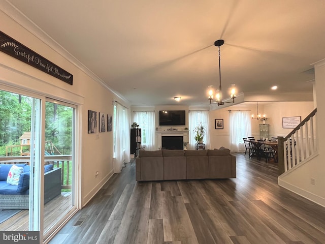 16801 Chalet Ct, Chesterfield, VA 23832 - living room featuring a chandelier, ornamental molding, dark wood finished floors, baseboards, and a fireplace