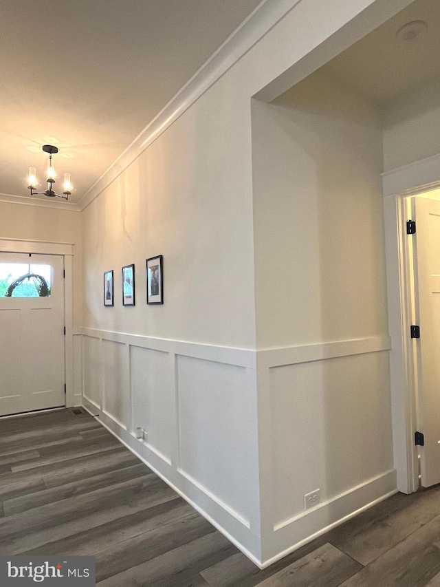 16801 Chalet Ct, Chesterfield, VA 23832 - corridor with dark wood-style flooring, ornamental molding, wainscoting, a chandelier, and a decorative wall