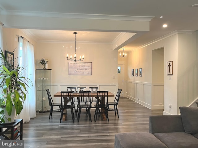 16801 Chalet Ct, Chesterfield, VA 23832 - dining area with a chandelier, dark wood-type flooring, a wainscoted wall, crown molding, and a decorative wall