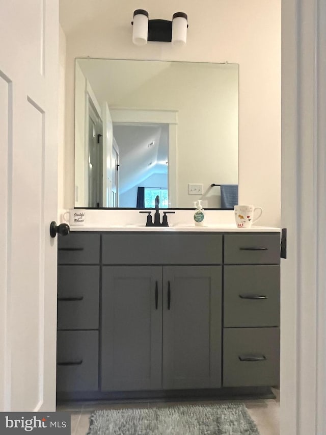 16801 Chalet Ct, Chesterfield, VA 23832 - bathroom featuring lofted ceiling, vanity, and tile patterned floors