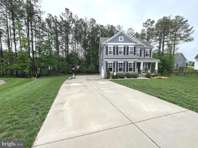 16801 Chalet Ct, Chesterfield, VA 23832 - view of front of house featuring a front lawn, a porch, and board and batten siding