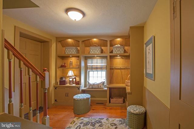 1249 Pebble Hill Rd, Doylestown, PA 18901 - foyer featuring light wood-style floors, stairs, and a textured ceiling