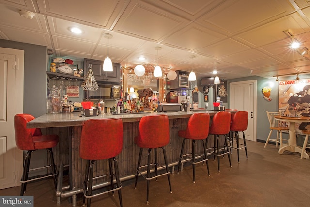 1249 Pebble Hill Rd, Doylestown, PA 18901 - indoor dry bar featuring black microwave, finished concrete floors, an ornate ceiling, and hanging light fixtures
