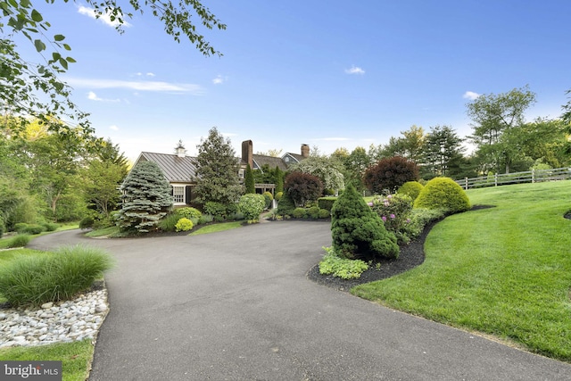 1249 Pebble Hill Rd, Doylestown, PA 18901 - view of front facade featuring asphalt driveway, metal roof, and a chimney