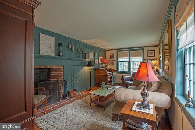 1249 Pebble Hill Rd, Doylestown, PA 18901 - living area featuring tile patterned flooring, a fireplace, and crown molding