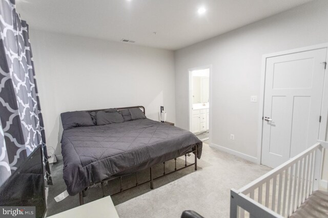 644 Lakemont Dr, Glen Burnie, MD 21060 - bedroom with light carpet, baseboards, and ensuite bathroom