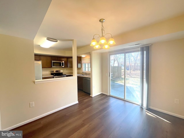 4522 Grouse Pl, Waldorf, MD 20603 - kitchen featuring stainless steel appliances, dark wood-style flooring, dark brown cabinets, and baseboards