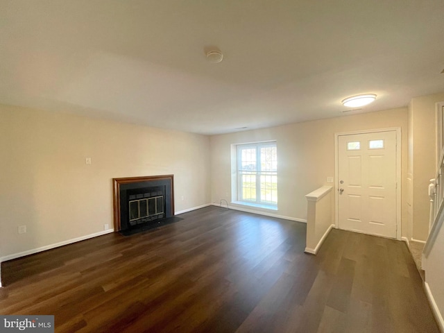 4522 Grouse Pl, Waldorf, MD 20603 - unfurnished living room featuring dark wood-style floors, baseboards, and a fireplace with flush hearth